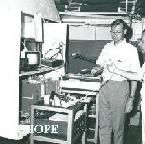 Dr. Daniel Verne hands phone to Kim Kaiser after talking to Washington, DC.